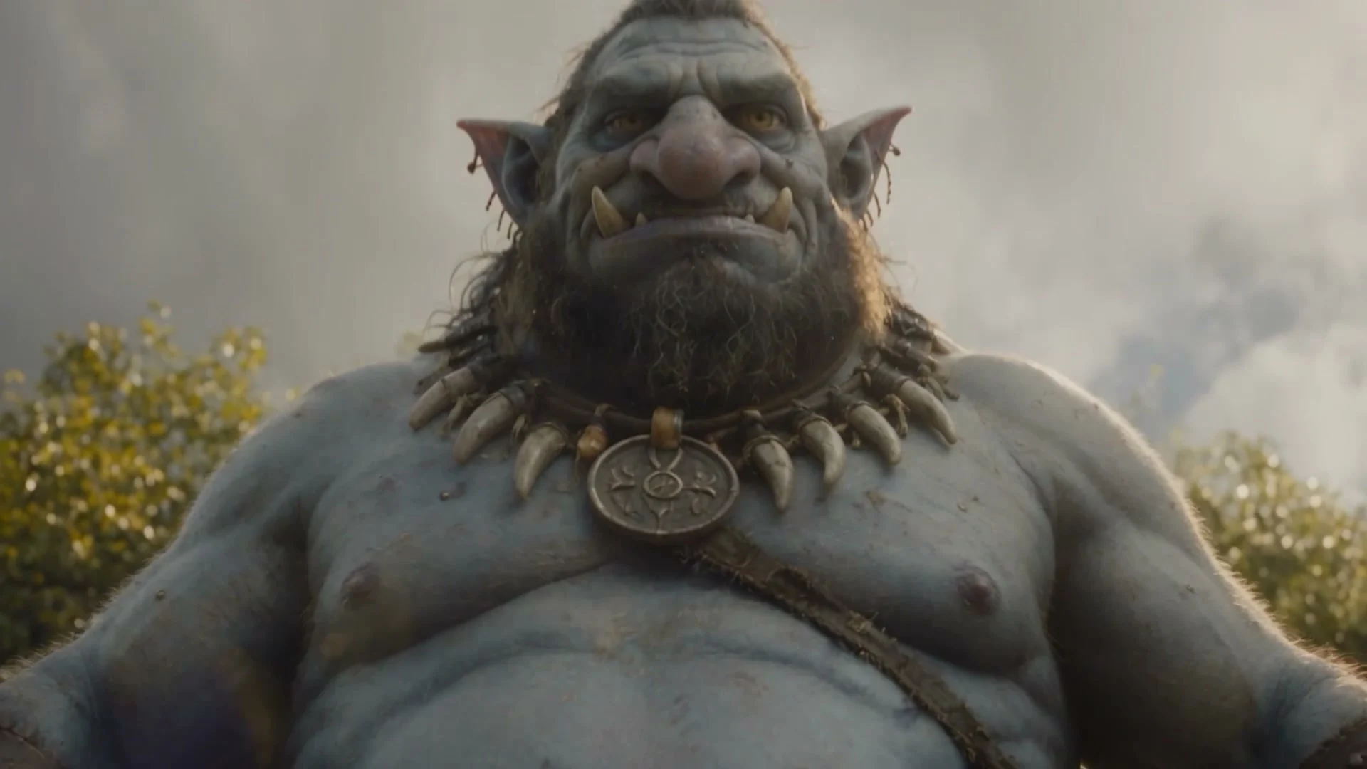 A weathered, tusked troll in a forest clearing